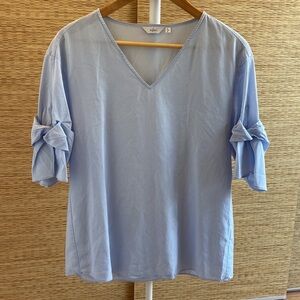 Blouse with ribbon sleeve design